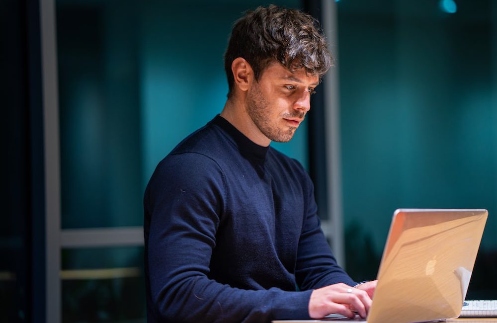 man on a computer doing some real estate prospecting